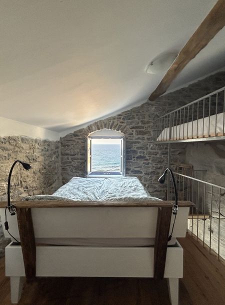 bedroom with seaview in holiday apartment kafenio in ikaria